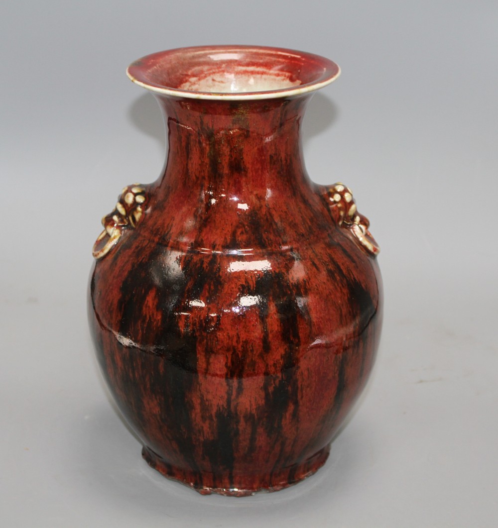 A Chinese flambe vase, with lion mask ring handles to the shoulder, H. 28.5cm